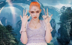 Grimes Fuels Pregnancy Buzz With Nude 'Knocked Up' Post
