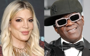 Tori Spelling Packs on PDA With Mystery Man After Getting Flirty With Flavor Flav