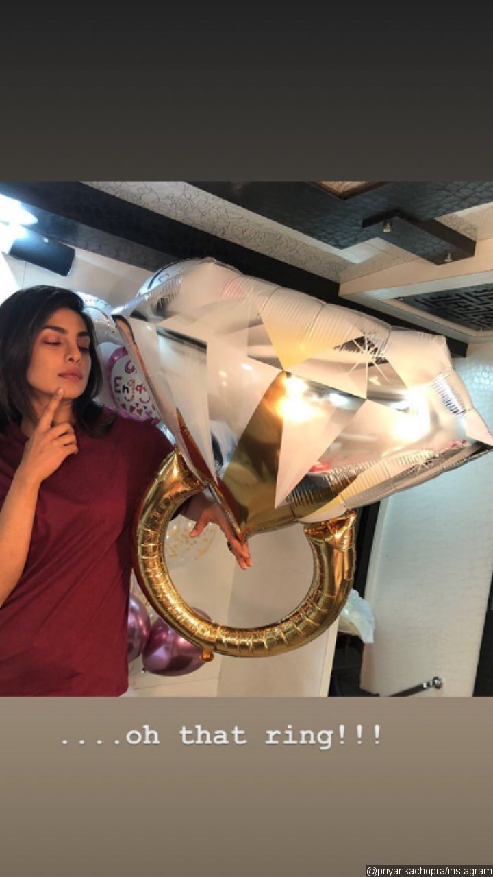 Priyanka Chopra shows off a diamond-ring shaped balloon