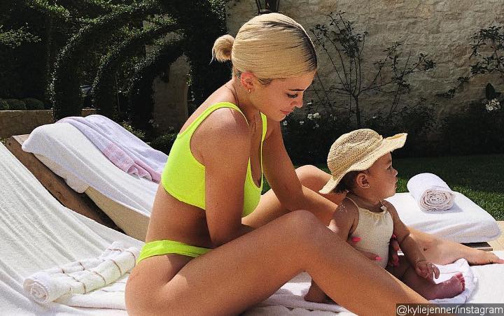 Kylie Jenner Flaunts Hot Body in Neon Bikini While Hanging Out With Stormi in New Pics