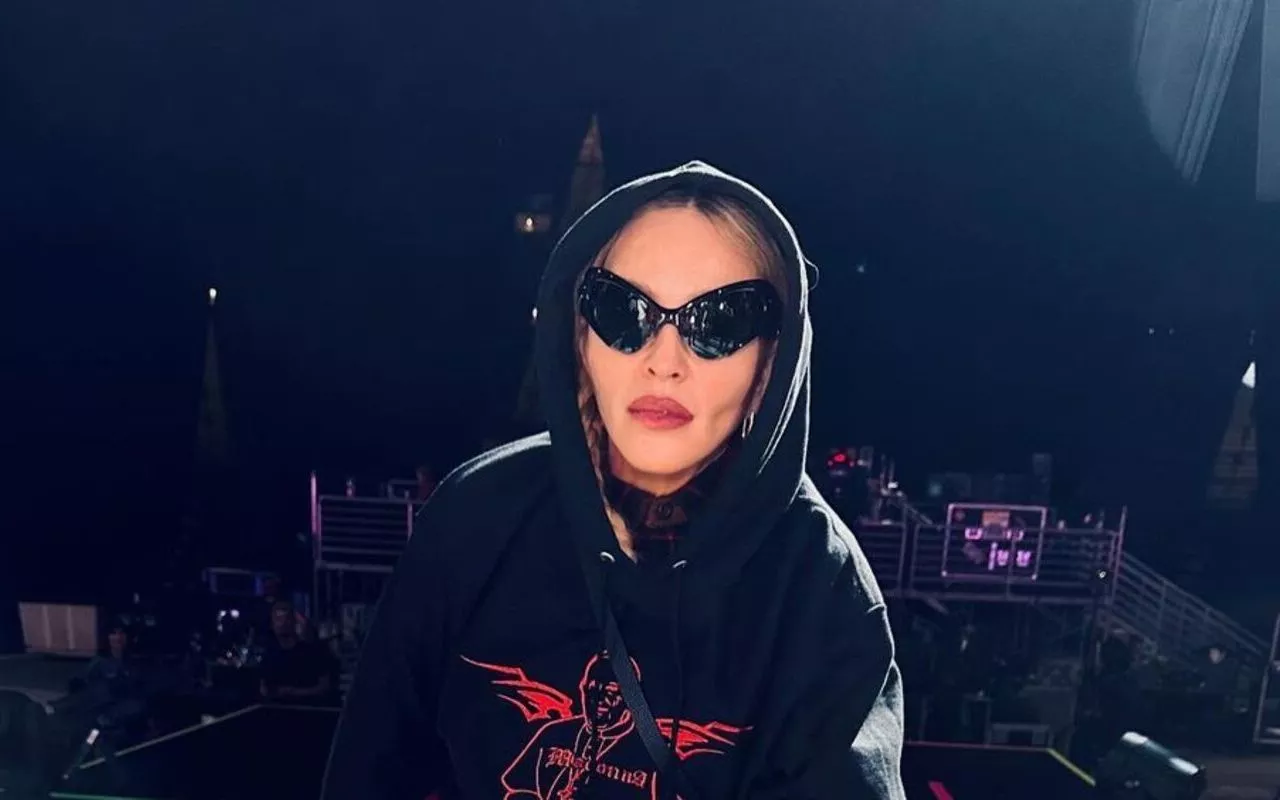 Madonna Gives Middle Finger While Wearing Pope Hoodie 