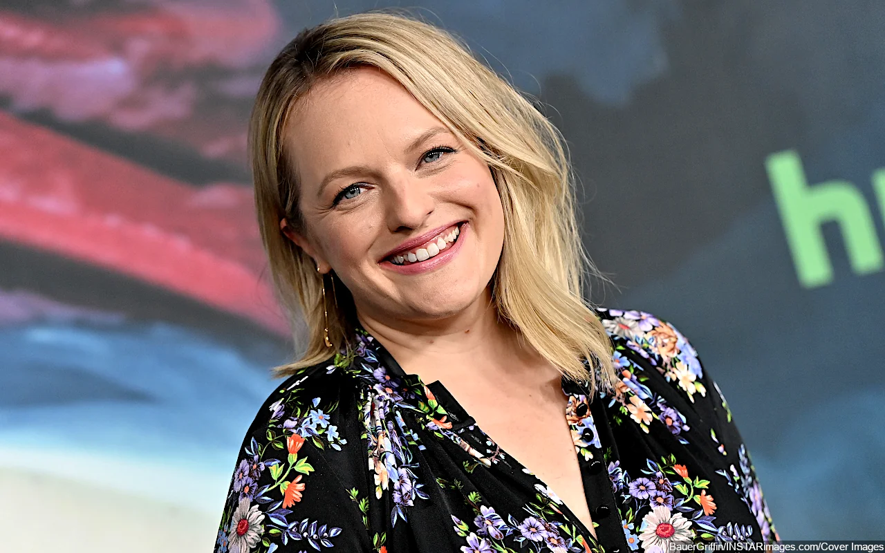 Elisabeth Moss Appears in Pain as She Caresses Her Stomach in Rare Sighting