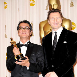 Yojiro Takita, Liam Neeson in 81st Annual Academy Awards - Press Room