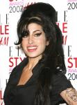 Amy Winehouse Lashes Out on a Fan and Kanye West at Glastonbury