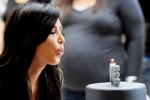 Pics: Kim Kardashian Presented With Birthday Cake at Autograph Signing Session