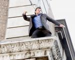 Pics: Sam Worthington Throws Money on Set of 'Man on a Ledge'