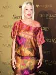 Attempting to Flee Paparazzi, Tori Spelling Crashes Car Into School Wall