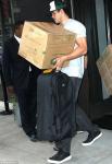 Kim Kardashian's Husband Seen Carrying Boxes Out of Hotel Without Wedding Ring