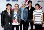The Wanted Accused of Drenching a Man With Champagne