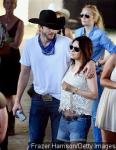 Mila Kunis Flashes Baby Bump at Stagecoach Festival With Ashton Kutcher