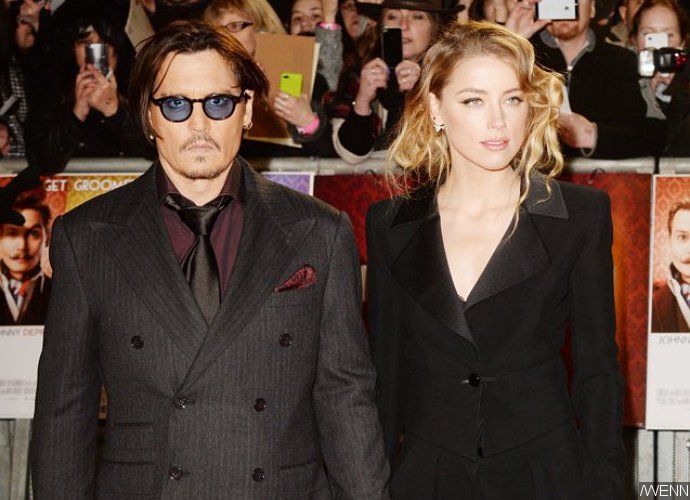 Amber Heard Denies She Blackmailed Johnny Depp