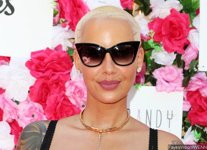 NSFW! Amber Rose Bares Her Unshaven Crotch in Completely Bottomless Picture
