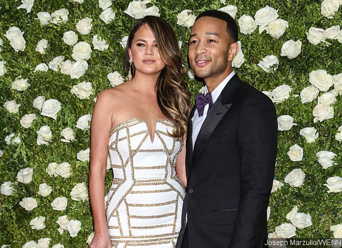 Chrissy Teigen Accidentally Flashes Bare Boob When Dancing With John Legend During His Concert