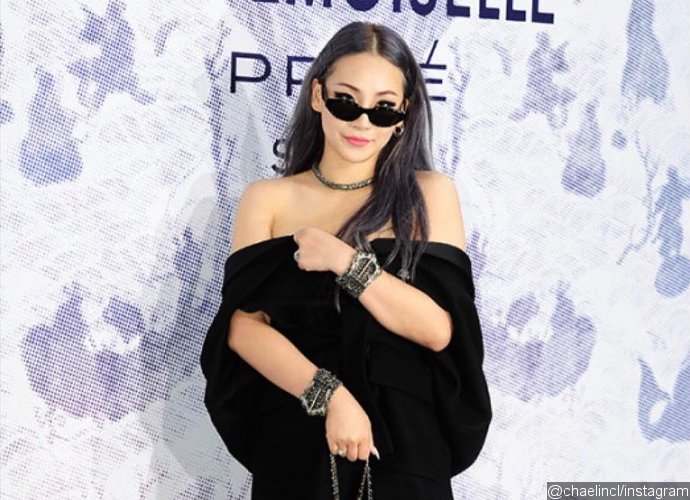 CL's Boobs Almost Pop Out of Her Plunging Black Dress at Chanel Exhibition
