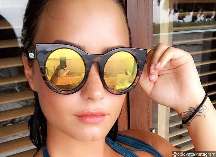 Ready for Summer! Demi Lovato Flaunts Major Cleavage in Plunging Swimsuit