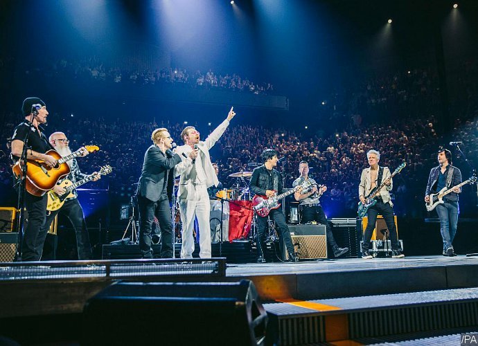 Eagles of Death Metal Joins U2 at Paris Concert. Watch Their Comeback After the Terrorist Attacks