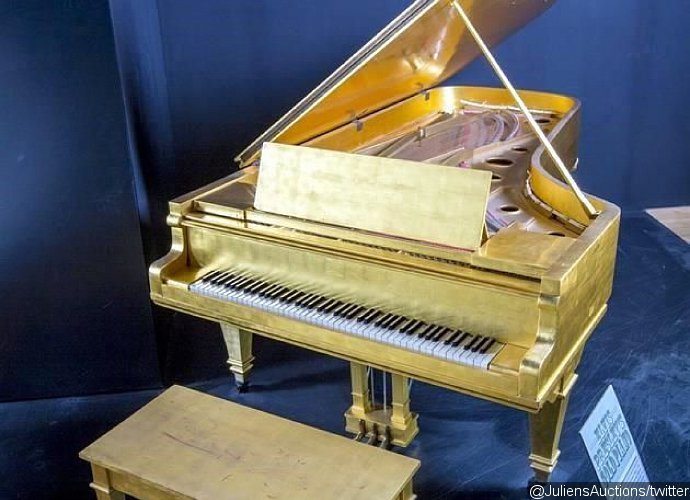Elvis Presley's Gold Piano and Beatles Drum Skin Set for Auction