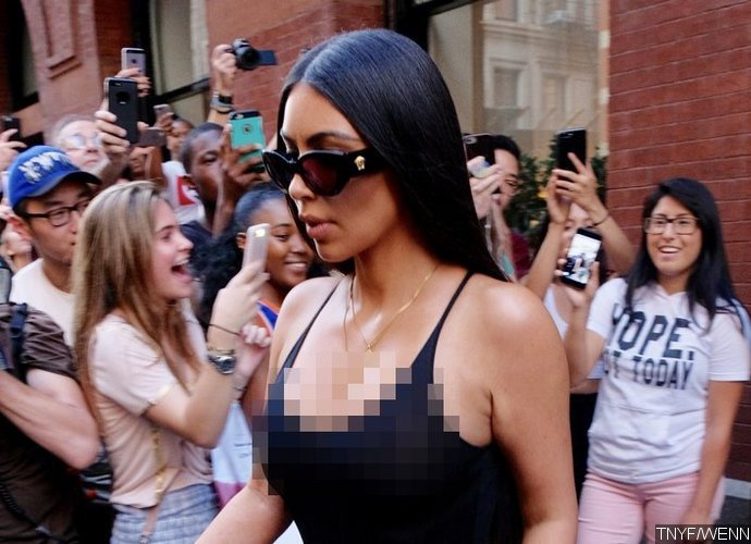 Kim Kardashian Flashes Nipples and Sideboob in White Tank Top