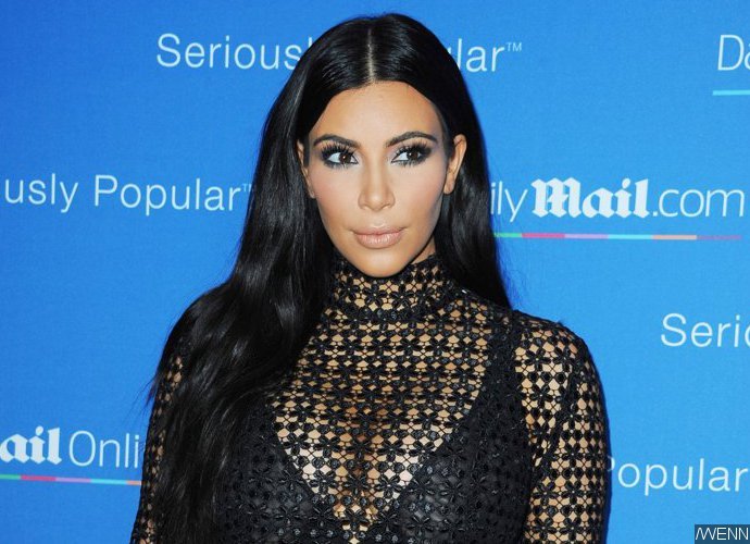 Kim Kardashian Flashes Some Serious Underboob While Taking Shower in Mexico