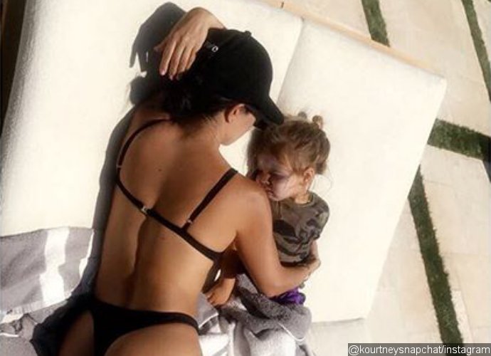Kourtney Kardashian Cuddles Up to Son Reign in Skimpy Bikini