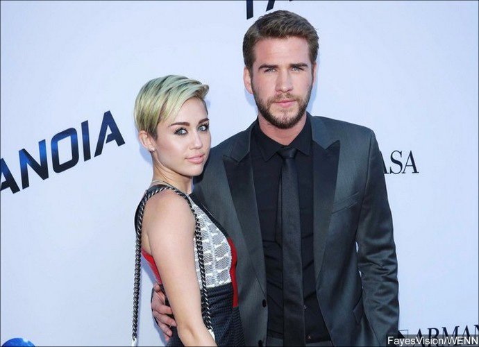 Miley Cyrus Flaunts Toned Abs While Hiking With Fiance Liam Hemsworth