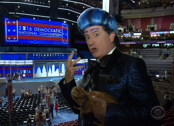 Watch Stephen Colbert Crash and Get Kicked Off DNC Stage During 'Hunger Games' Spoof