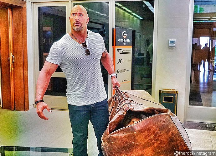 The Rock Carries Giant Bag as He Shares Tip to 'Travel Light'. What's Inside the Bag?