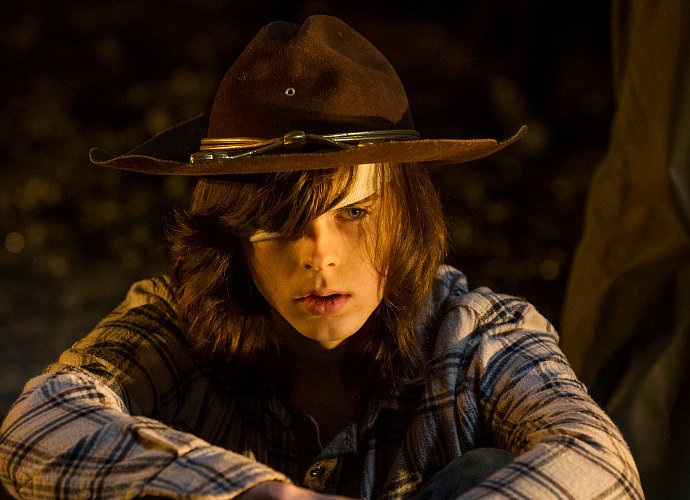 New 'The Walking Dead' Photo Teases Graphic Scene for Carl in 'Sing Me a Song'