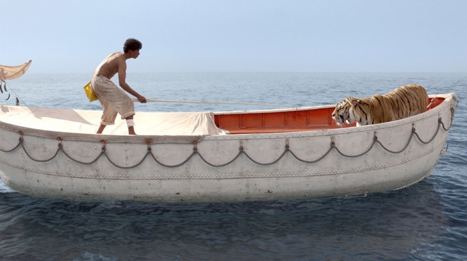 Suraj Sharma stars as Pi Patel and Richard Parker the Tiger in The 20th Century Fox's Life of Pi (2012)