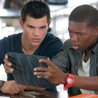 Taylor Lautner stars as Nathan and Denzel Whitaker stars as Gilly in Lionsgate Films' Abduction (2011)