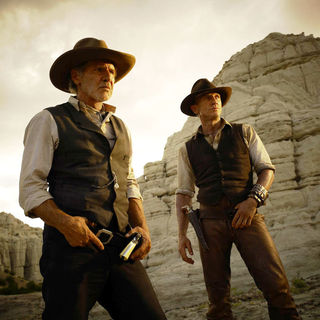 Daniel Craig stars as Jake Lonergan and Harrison Ford stars as Col. Woodrow Dolarhyde in DreamWorks Pictures' Cowboys and Aliens (2011)