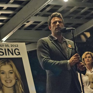 Rosamund Pike stars as Amy Dunne and Ben Affleck stars as Nick Dunne in 20th Century Fox's Gone Girl (2014)