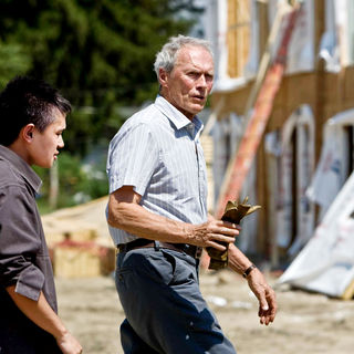 Bee Vang stars as Tao Vang Lor and Clint Eastwood stars as Walt Kowalski in Warner Bros. Pictures' Gran Torino (2008). Photo credit by Anthony Michael Rivetti.