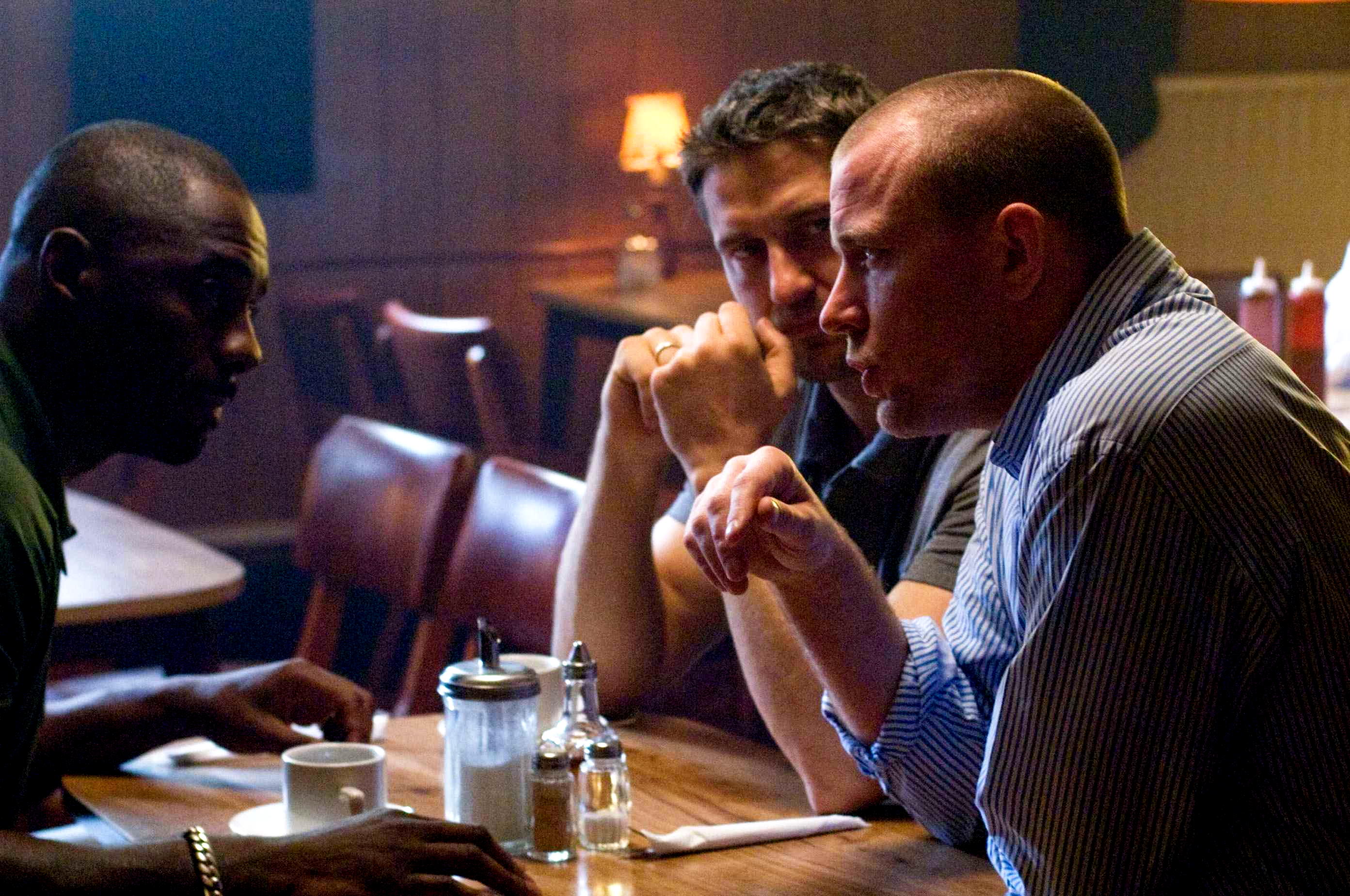 Idris Elba, Gerard Butler and Director Guy Ritchie in Warner Bros Pictures' RocknRolla (2008). Photo credit by Alex Bailey.
