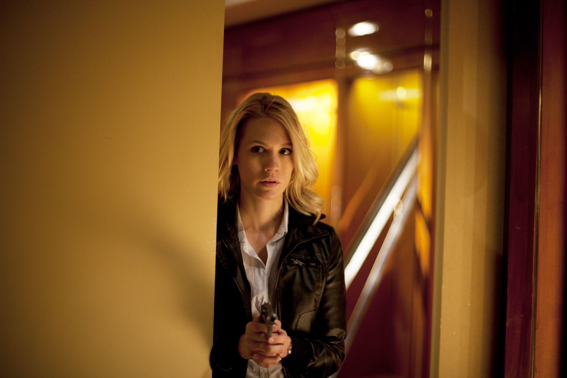 January Jones stars as Laura Gerard in Anchor Bay Films' Seeking Justice (2012). Photo credit by Alan Markfield.