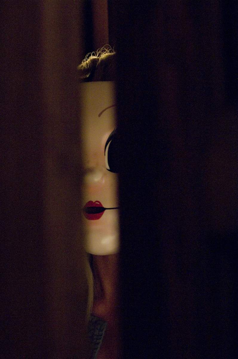 Pin-Up Girl (LAURA MARGOLIS) hunts her prey in Rogue Pictures' The Strangers (2008).