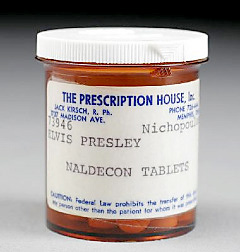 Elvis Presley's Pills and Gold Gun Among Items Sold at Julien's Summer Auction