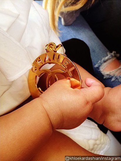Khloe Kardashian Shares Photo of North West Holding Her Chanel Earring