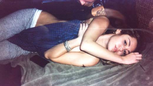 Topless Miley Cyrus Photographed While Getting Tattoo