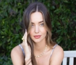 Miranda Kerr Flaunts Baby Bump in Stunning Red Dress for Christmas Eve