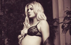Khloe Kardashian Cradles Growing Baby Bump in Sexy Lingerie Snap