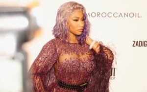 Nicki Minaj Rips Her Dress at Daily Front Row Fashion Awards: 'My Whole Butt Is Out'