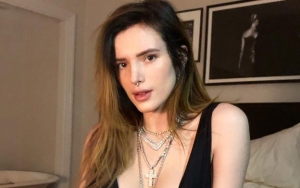Pics: Bella Thorne Bares Hairy Armpit in Skimpy Bikini, Washes Hair With Beer