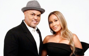 Read Adrienne Bailon's Husband's Savage Clapback to Troll Criticizing Them for Not Having a Child 