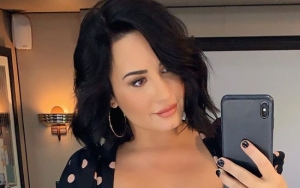 Demi Lovato Gives Fans Minor Heart Attack With Photo of Her Cradling 'Baby Bump'