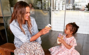 Chrissy Teigen Savagely Claps Back at Trolls Sexualizing Her Sweet Moment With Daughter