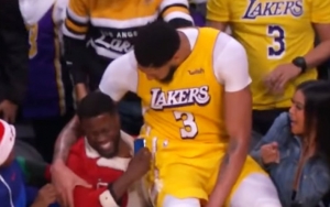 NBA Star Anthony Davis Falls on Kevin Hart's Lap During Christmas Match