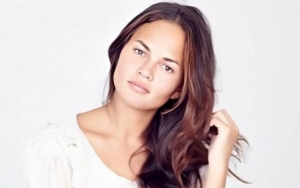 Chrissy Teigen Unveils Her COVID-19 Test Was Preparation to Getting Reverse Boob Job