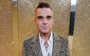Robbie Williams Confined to St. Barts Villa After Testing Positive for COVID-19