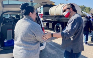 Ted Cruz Accused of Gaslighting by Handing Out Water Bottles After Cancun Fiasco